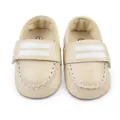 Detailansicht beige Babyschuhe mit weißen Streifen und Klettverschluss. - Aprikose