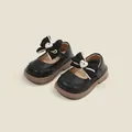 Zapatos de princesa de cuero negro para niña con lazo grande y detalle de corazón - Negro