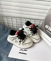 Detail of white 2D sketch style toddler sneakers with black outlines and laces - Black