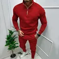 Detail of men's red leisure tracksuit featuring a half-zipper stand collar and cozy fleece - S / Top And Bottom / Red