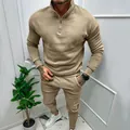 Close-up detail of khaki men's 1/4 zip tracksuit with premium textured fabric - Camel