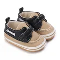 Coppia di scarpe primi passi per neonati nere e beige con suole morbide e velcro - Nero
