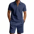 Vista dettagliata del set polo con zip e pantaloncini blu navy con trama a nido d'ape - Blu Notte