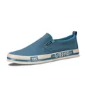 Casual men's blue washed canvas slip-on shoe with white flat sole and side label - 38 / Star Blue