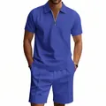 Primo piano di completo polo e pantaloncini blu a nido d'ape con cerniera. - Blu zaffiro