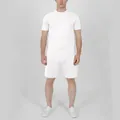 Full body view of a male model wearing a casual white short sleeve t-shirt and shorts set - M / Top And Bottom / White