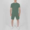 Full body view of a man wearing a sage green t-shirt and matching shorts set - Army Green