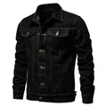 Detail view of a men's stylish black slim-fit denim jacket with white stitching details - M / Tops / Black