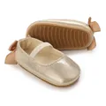 Close-up of gold glitter baby shoes showing anti-slip soft sole and bow detail - 11cm / Gold
