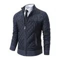 Macro detail of men's slim fit knitted cardigan with quilted windproof front panel - Blue