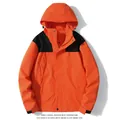 Stylish orange and black color-block waterproof windbreaker jacket for outdoor wear - Orange