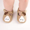 Detail view of baby pre-walker shoes with a cute pear design and soft tan leather - 11cm / Camel