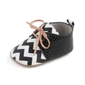 Detail view of infant baby walker shoe with chevron pattern and snakeskin texture. - 11cm / 2193 Black (Black and White Zigzag Patchwork)