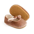 Detail view of velvet baby shoes showing texture and anti-slip rubber sole pattern - Apricot
