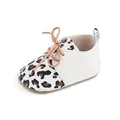 Close-up view of leopard print baby pre-walker shoes with textured white panels - 11cm / 2195 White (Leopard Print Patchwork)