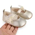 Detail shot of gold metallic baby princess shoes with lace bow and rubber sole - Insole Length 11cm / Gold