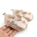 Close-up of gold metallic baby princess shoes with pink tulle bow details - Insole Length 11cm / Gold