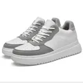 Stylish white and grey low-top sneakers for outdoor travel and casual daily wear - White & Gray