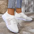 Detail of white fly-knit mesh sneakers with breathable texture and casual lace-up design - 36 / White