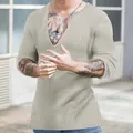 Detailed view of men's beige slim fit ribbed knit sweater featuring a deep V-neck design - Apricot