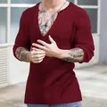 Close-up detail of men's burgundy slim-fit long sleeve ribbed knit shirt with deep V-neck - Wine Red