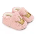 Detail of pink fleece baby shoes with gold crown appliqué and soft plush lining - Pink