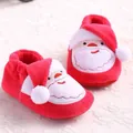 Detailed macro view of festive red Santa Claus themed baby winter warm fleece booties - Inner Length 11cm / Red Santa Claus Plush Style (652)
