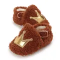 Detail view showing soft sherpa texture and golden crown on baby pre-walker shoes - Tan