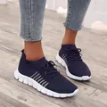 Navy blue breathable flyknit sneakers with white chunky soles and lace-up closure - Dark Blue