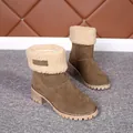 Close-up of olive suede winter boots with plush faux fur fold-over cuffs and lug soles. - 35 / Khaki