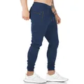 Vista lateral de pantalones jogger azul marino para hombre con bolsillos de cremallera - S / Bottoms / Azul marino