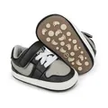 Detail view of the anti-slip soft sole on these black and grey infant learner shoes - 11cm Inner Length / Black