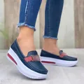 Detailed side view of navy blue platform loafers for women with decorative metal buckle - Blue