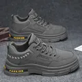 Elegantes botas de trabajo bajas grises para hombre con suelas gruesas y detalles modernos - Gris
