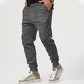 Close-up detail of dark grey men's joggers with elastic waistband and drawstring. - S / Bottoms / Dark Gray