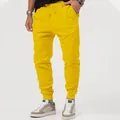 Vibrant yellow men's casual joggers with elastic waistband and drawstring - Yellow