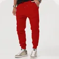 Comfortable men's red sports joggers featuring drawstring waist and elastic cuffed ankles - S / Bottoms / Red