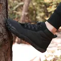 Black mid-top winter hiking boots with fleece lining in outdoor setting - 38 / Black