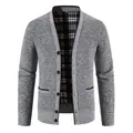 Close-up of men's thick knit cardigan featuring textured grey fabric and plaid lining detail - M / Tops / Light Gray