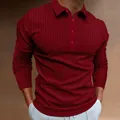 Close-up detail of a men's burgundy ribbed long-sleeve polo shirt with four buttons - S / Tops / Red