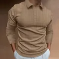 Detailed shot of the khaki ribbed texture on a men's slim fit long sleeve polo - Khaki