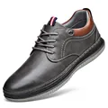 Moderner Herren Freizeit-Schnürschuh aus grauem Leder mit weicher Sohle und braunem Akzent - Schnürstil