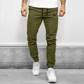 Front detailed view of men's olive green cargo joggers featuring a drawstring waist - M / Bottoms / Army Green