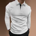 Close-up detail of white long sleeve polo shirt with black button placket and cuffs - M / Tops / White