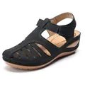 Close-up detail of black retro closed-toe wedge sandals featuring a stylish cutout design - 38 / Black