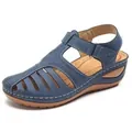 Detail view of women's vintage blue closed-toe hollow-out wedge sandals with velcro strap - 38 / Navy Blue