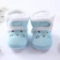 Macro view of light blue soft fleece baby boots featuring a cute cartoon face embroidery - Size 12 (Inner Length 10.5cm) / Blue (Rabbit Embroidery Style MX002)