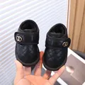 Black quilted toddler snow boots featuring warm fleece lining and gold ring accents - Size 22 (Length 15cm) / Black
