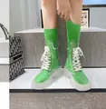 Fashionable transparent mid-calf boots with neon green socks and chunky white soles - 35 / Green