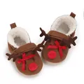 Close-up detail of reindeer baby winter shoes with soft fleece lining and red bow - Inner Length 11cm / Brown
